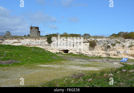 Guard towers overlook the Robben Island Prison Limestone Quarry where Nelson Mandela and other political prisoners labored. Stock Photo