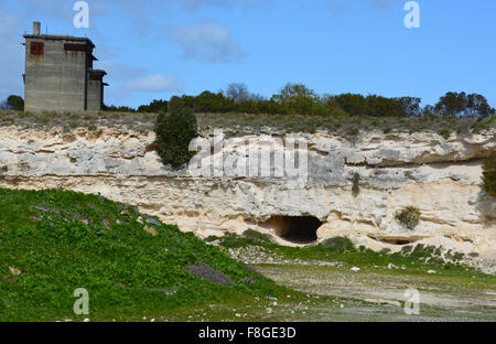 Guard towers overlook the Robben Island Prison Limestone Quarry where Nelson Mandela and other political prisoners labored. Stock Photo