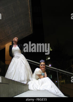 Crossed dressed brides on the steps Stock Photo