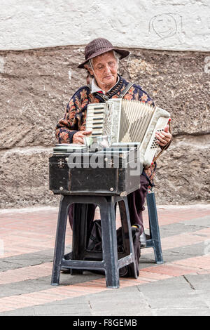 Woman playing accordion in the Historical Center, Quito, Ecuador Stock Photo