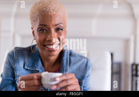 African American woman drinking coffee Stock Photo