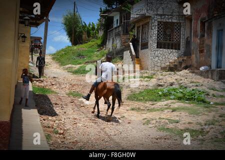 local bareback horse rider on a dirt track on the outskirts of Trinidad Sancti Spiritus Province Cuba Stock Photo