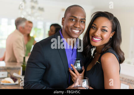 Couple drinking wine at party Stock Photo