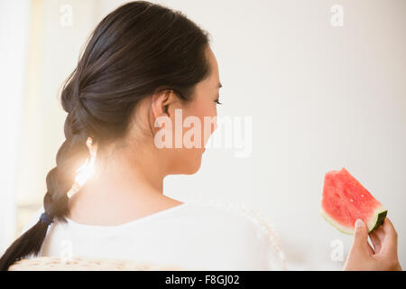 Chinese woman eating watermelon Stock Photo