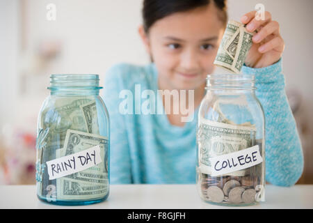 Girl saving money in college fund
