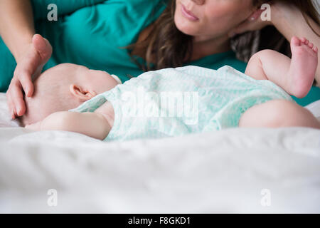 Mother playing with baby daughter Stock Photo