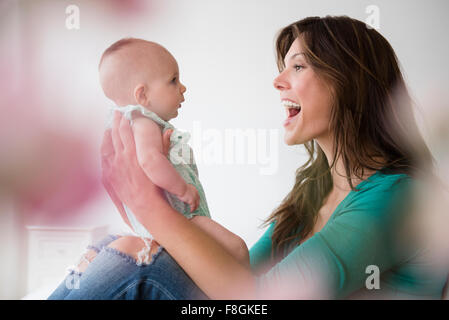 Mother holding baby daughter Stock Photo