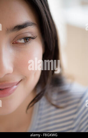 Close up of face of smiling Hispanic woman Stock Photo