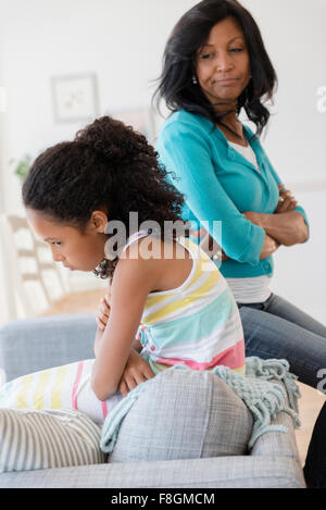 Mother and daughter arguing on sofa Stock Photo
