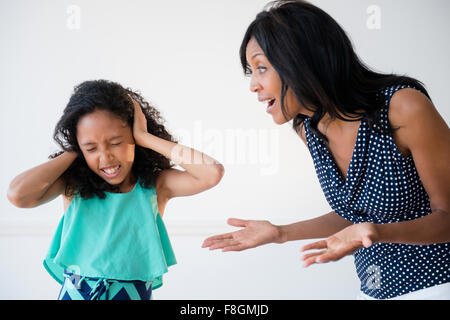 Daughter ignoring yelling mother Stock Photo
