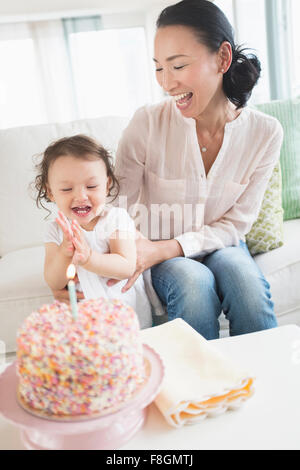 Mother and baby daughter celebrating birthday Stock Photo