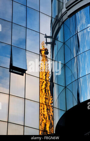 One of the towers of Stephansdom (St. Stephen's cathedral) reflected on Haas Haus,  Stephansplatz,  Vienna, Austria. Stock Photo