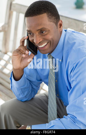 Black businessman talking on cell phone Stock Photo