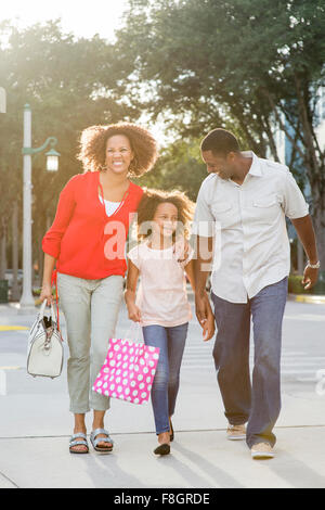 Smiling family walking outdoors