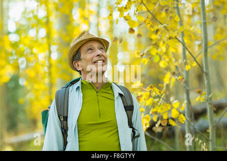 Man exploring autumn forest Stock Photo