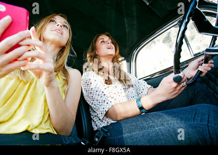 Women driving vintage car Stock Photo