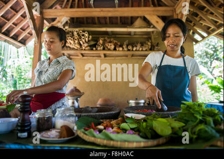 Asian chefs cooking in outdoor kitchen Stock Photo