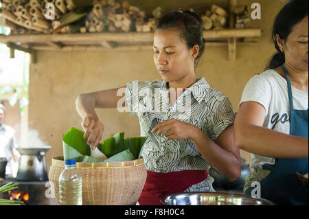 Asian chefs cooking in outdoor kitchen Stock Photo