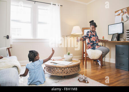 African American mother and daughter gesturing thumbs up Stock Photo