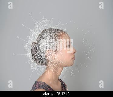 Mixed race girl with spider web pattern Stock Photo