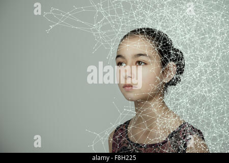 Mixed race girl with spider web pattern Stock Photo