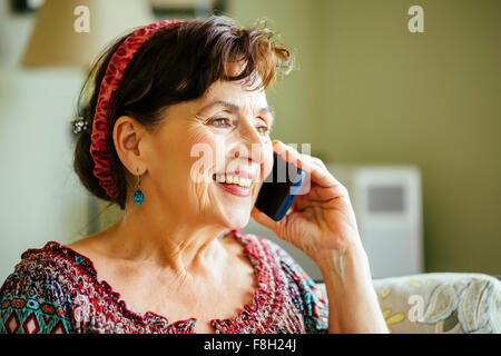 Caucasian woman talking on cell phone Stock Photo