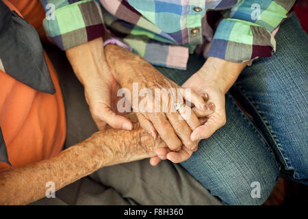 Mother and daughter holding hands Stock Photo