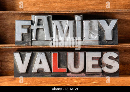 family values phrase made from metallic letterpress type on wooden tray Stock Photo