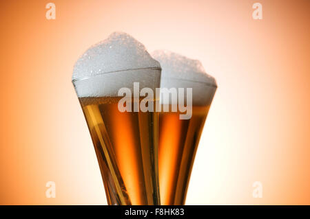 Beer glasses against the colorful gradient background Stock Photo