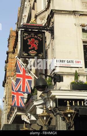 Union Jack flags fly outside The Red Lion pub in Parliament Street in London, UK. Stock Photo