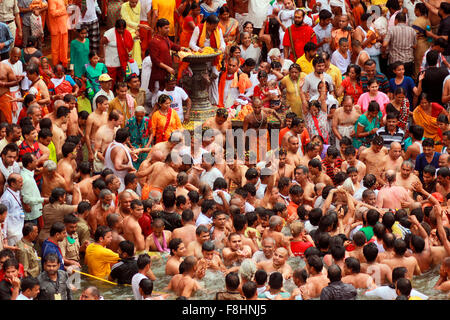 Shahi Snan. Holy men and devotees taking royal bath in holy river. Kumbh Mela, Nasik, Maharashtra, India Stock Photo