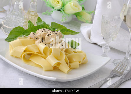 Italian pasta - Pappardelle with chicken fillet in a creamy sauce with sesame seeds Stock Photo