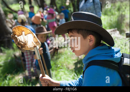 Boy on a microbiology excursion with his class, Warrumbungle Mountains National Park. Stock Photo