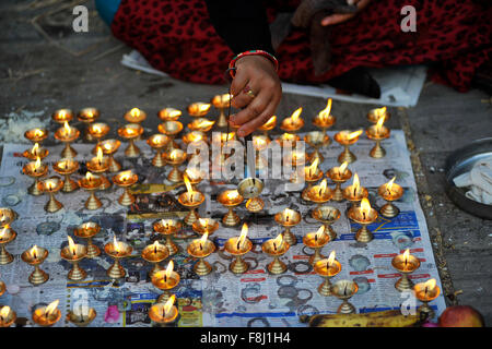 Kathmandu, Nepal. 10th Dec, 2015. Nepalese devotees offering 108 butter lamps at Pashupatinath Temple on the occasion of Bala Chaturdashi festival celebrated in Kathmandu. Bala Chaturdashi is also one of the religious festivals of the Hindus. It is believe that dropped seeds in remembrance of beloved ones on the occasion of Bala Chaturdashi rituals, can secure a better place in heaven for their beloved ones and their dead relatives. Credit:  Narayan Maharjan/Pacific Press/Alamy Live News Stock Photo
