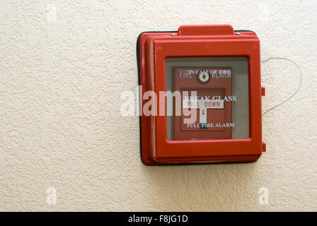 Fire Alarm Pull Station Box. Wall mounted manual fire alarm pull station switch encased in a glass box housing.