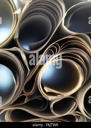 Full frame view through rolled up architectural drawings Stock Photo