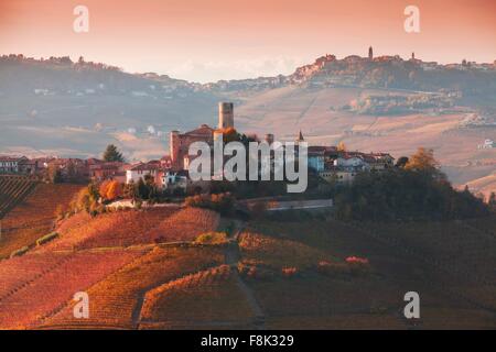 Elevated view of vineyards and hill town, Langhe, Piedmont Italy Stock Photo
