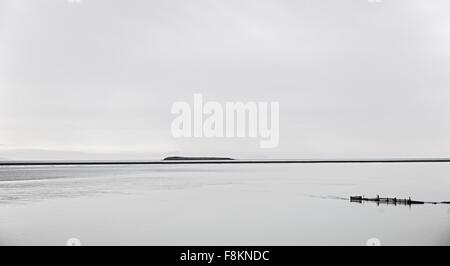 Silhouetted coastal island Saudarkrokur, Iceland Stock Photo