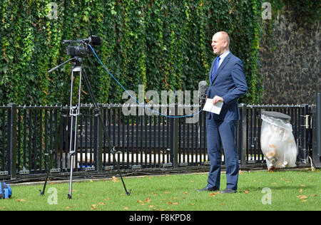 London, England, UK. Reporter doing a live news report single-handed - College Green opposite the Houses of Parliament Stock Photo