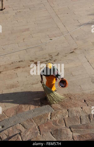 JAIPUR, INDIA - NOV 30: Indian woman cleaning the star inside the amber fort. View from the top on November 30 2012 Stock Photo