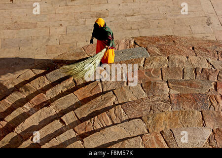 JAIPUR, INDIA - NOV 30: Indian woman cleaning the star inside the amber fort. View from the top on November 30 2012 Stock Photo