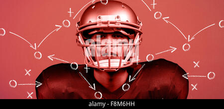 Composite image of portrait of determined american football player in uniform Stock Photo
