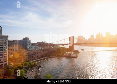 Elevated view of sunlit Brooklyn Bridge, New York, USA Stock Photo