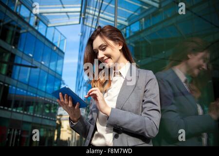 Businesswoman using digital tablet Stock Photo