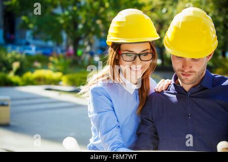 Building contractors wearing hard hats Stock Photo