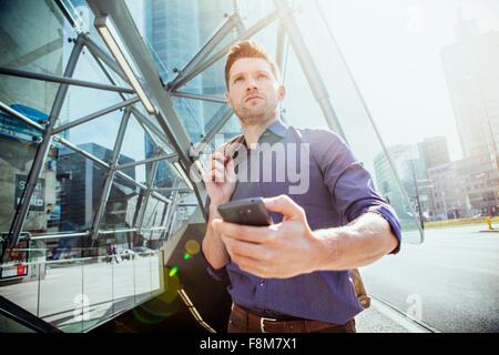 Businessman using smartphone Stock Photo