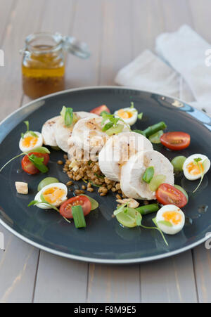 Poached chicken with spelt Stock Photo