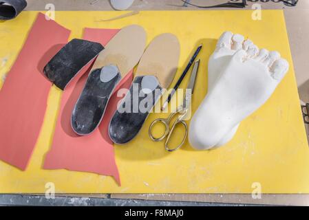 Shoe insoles made from plaster casts of feet in medical factory Stock ...