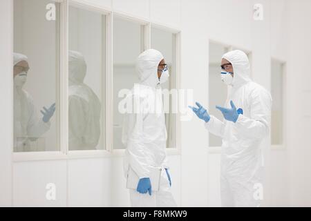 Scientists talking in laboratory Stock Photo