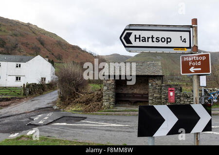 Hartsop, Cumbria, 10th December 2015. UK Weather.  Heavy overnight rain has led to further flooding in Cumbria, particularly around Glenridding.  Close to the nearby village of Hartsop evidence of the power of the floodwater from Storm Desmond could also be seen where it had damaged the road, an electric substation and the surrounding farmland. Credit:  David Forster/Alamy Live News Stock Photo